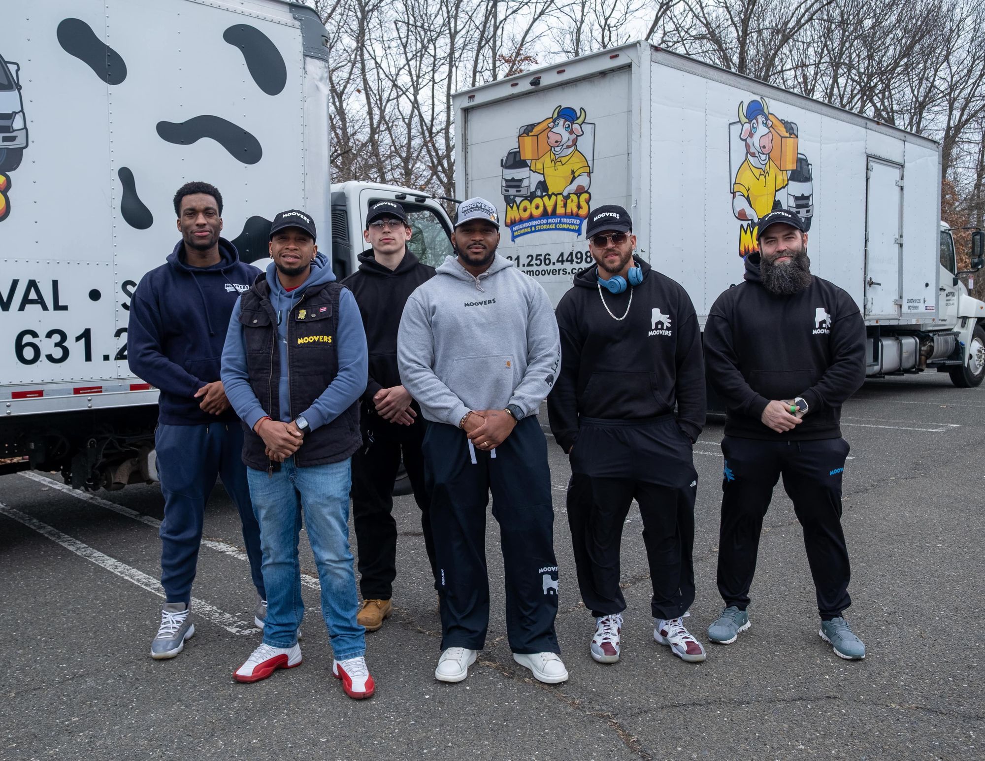 The Moovers team lined up in front of the trucks